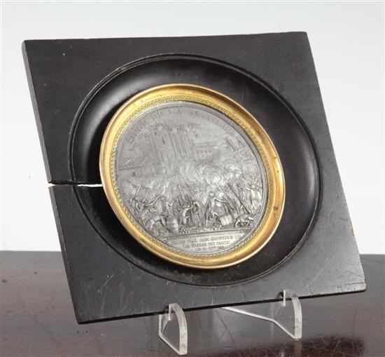 A late 18th century French lead medallion commemorating the Siege de la Bastille, overall 5.25 x 5.5in.